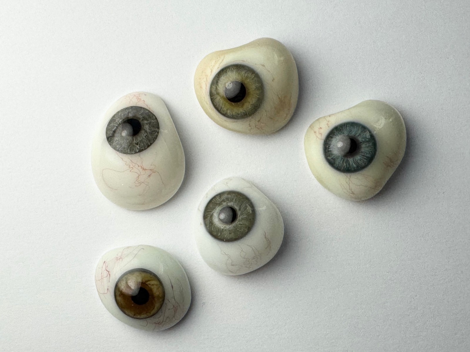 Lot of 5 antique German hand-blown human prosthetic glass eyes.  Reserved.