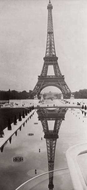 The Eiffel Tower in Paris reflects itself in the tank of the Troca- Old Photo The Eiffel Tower in Paris reflects itself in the tank of the Troca- Old Photo