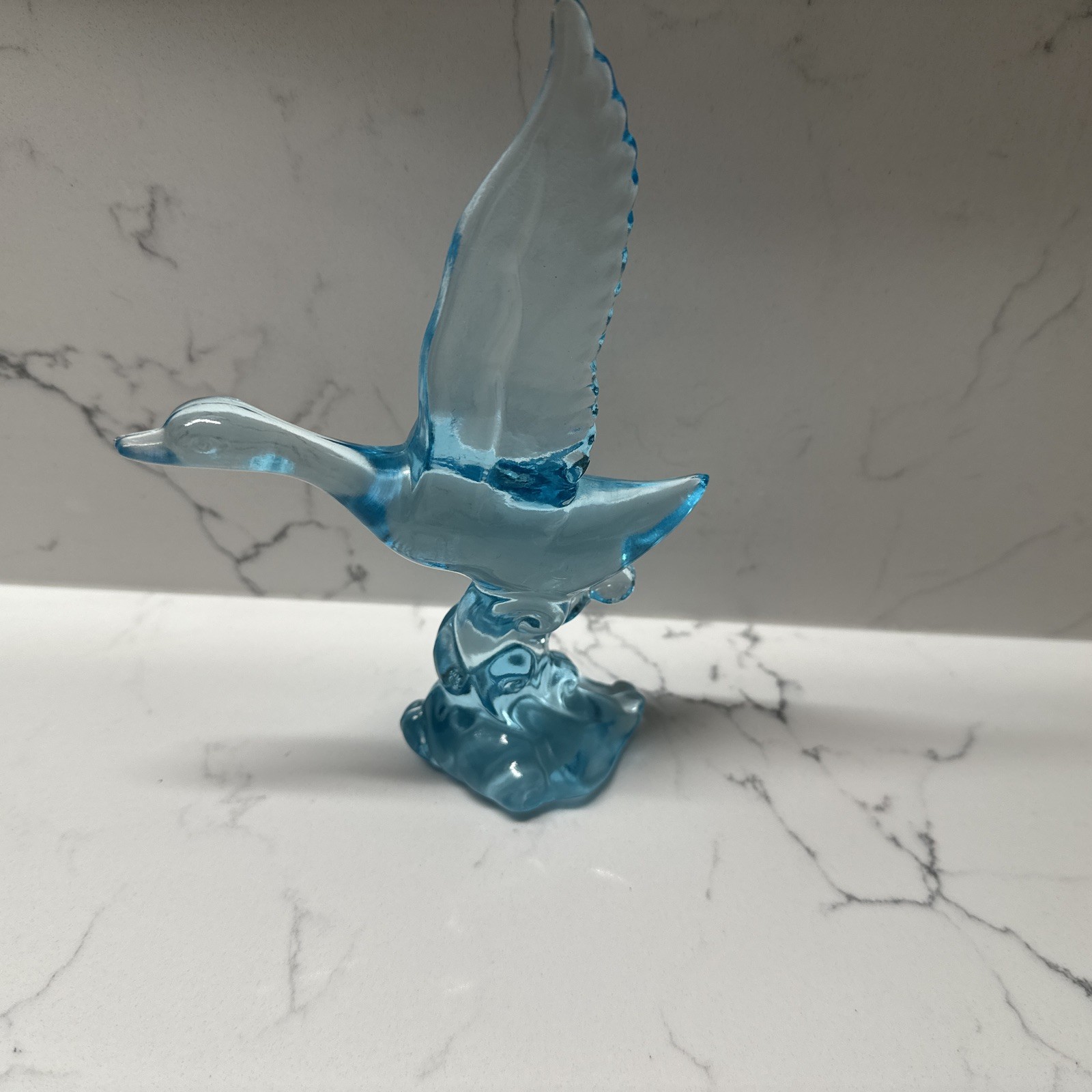 Blue Glass Duck In Flight