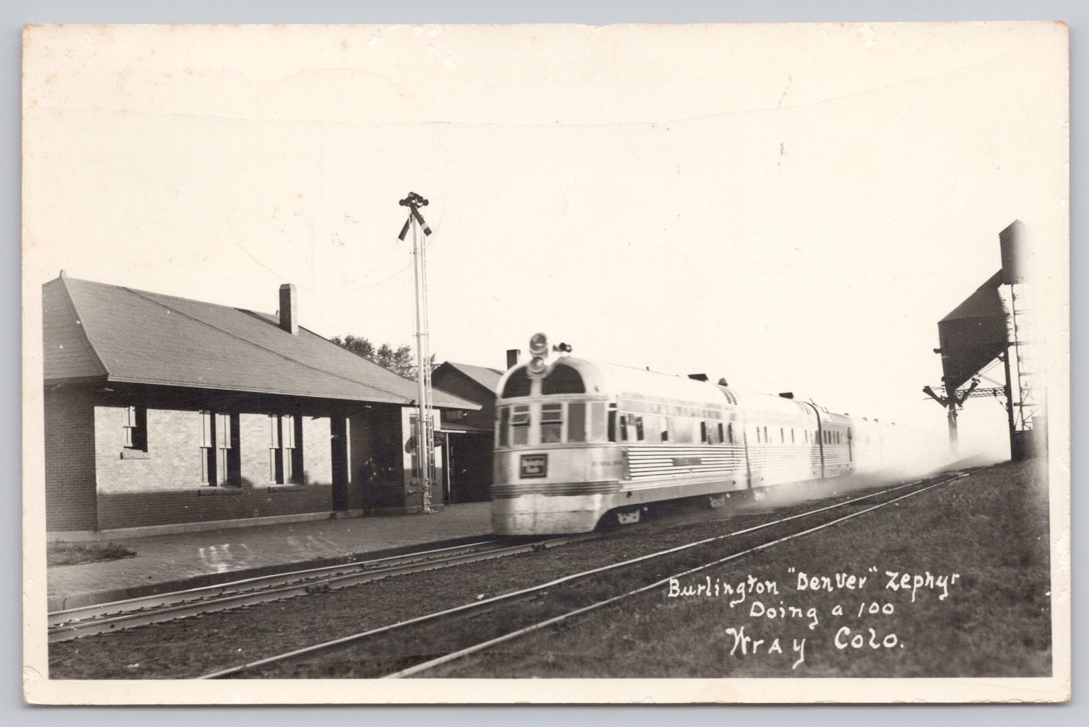 1940 RPPC Burlington Denver Zephyr Train Wray CO Railroad Depot Postcard