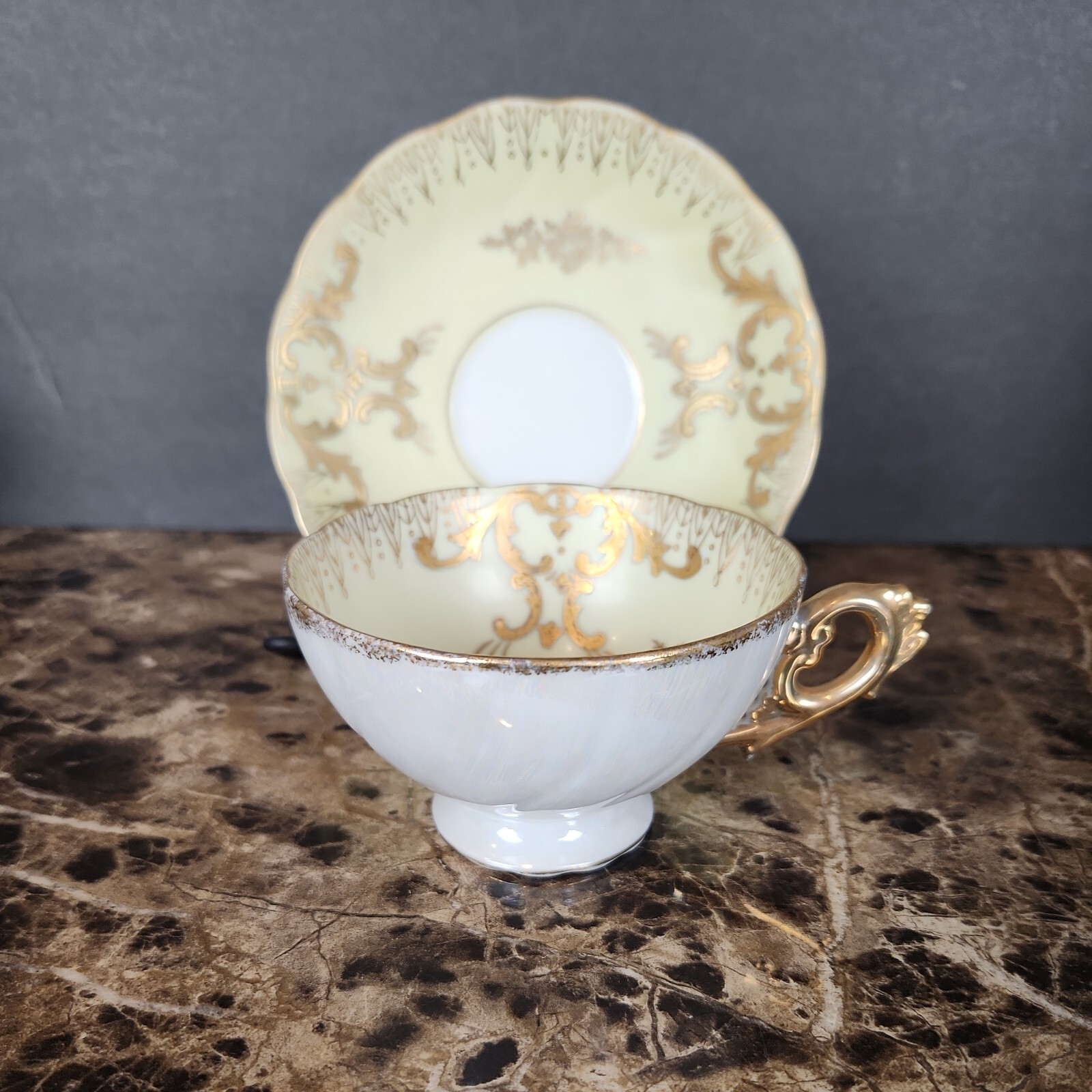 Vintage Yellow and Gold Pearlized Luster Footed Porcelain Tea Cup And Saucer 