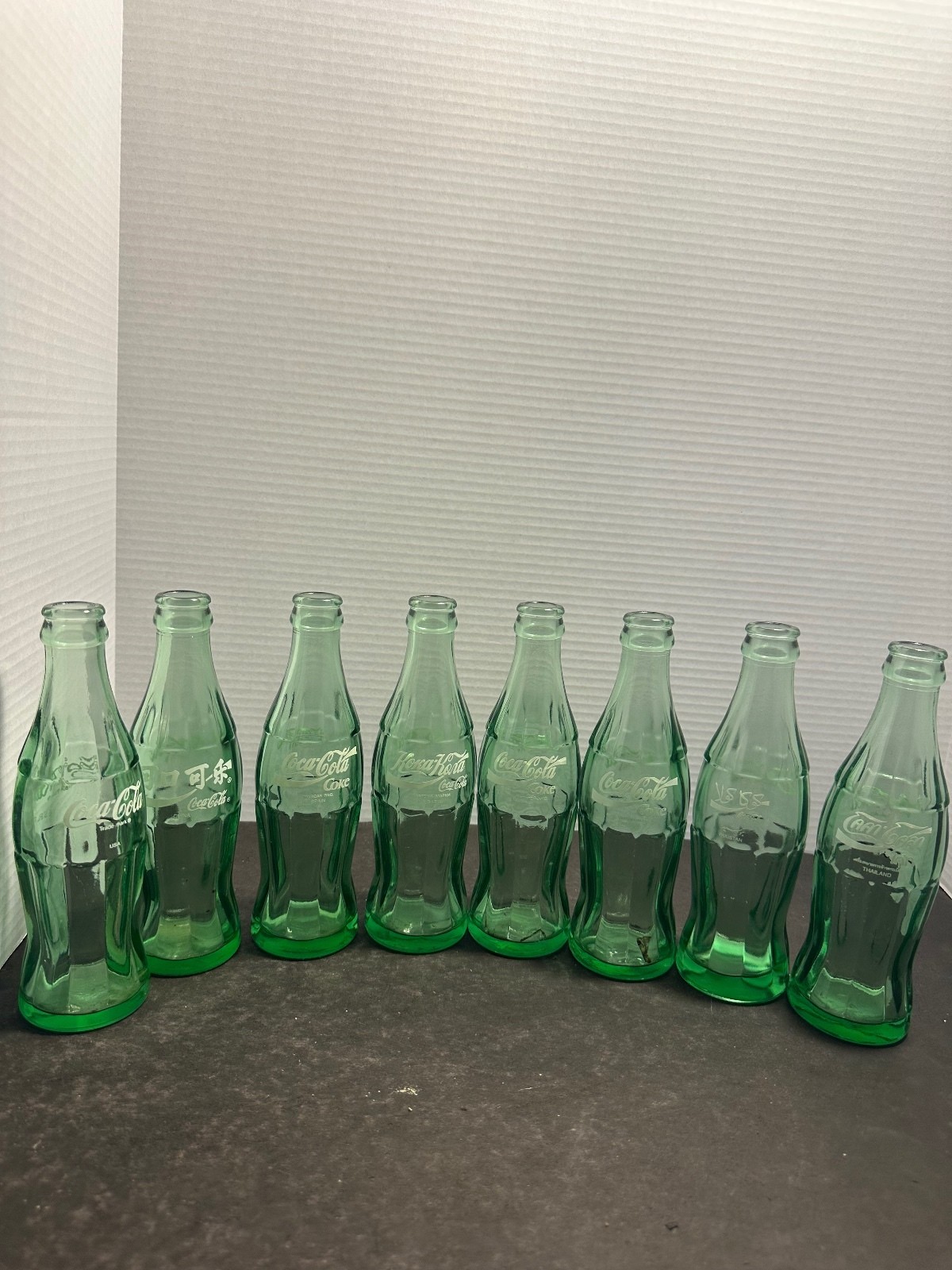 Vintage Coca Cola Around the World 8 bottle international collection Vintage Coca Cola Around the World 8 bottle international collection