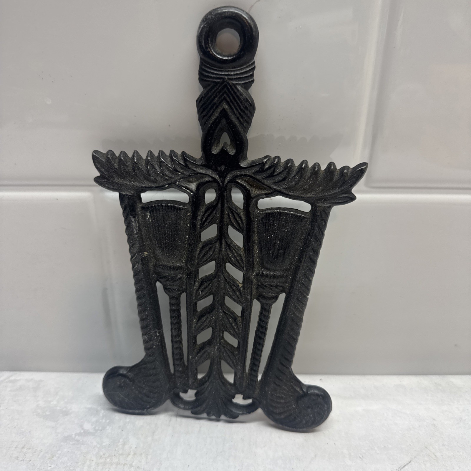 Vintage  Footed Black Cast Iron Kitchen Trivet Grain and Tassel 8.5\
