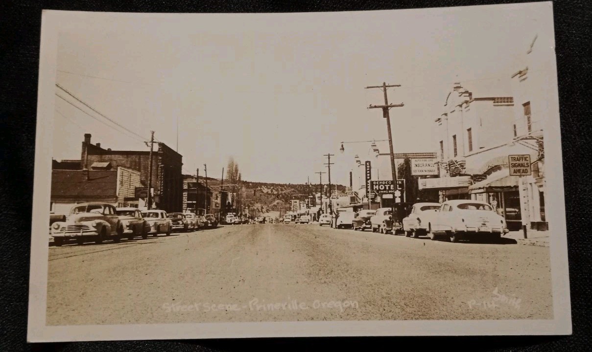 RPPC 1940s Prineville, Oregon Street Scene Downtown Motel Cars Coffee Shop