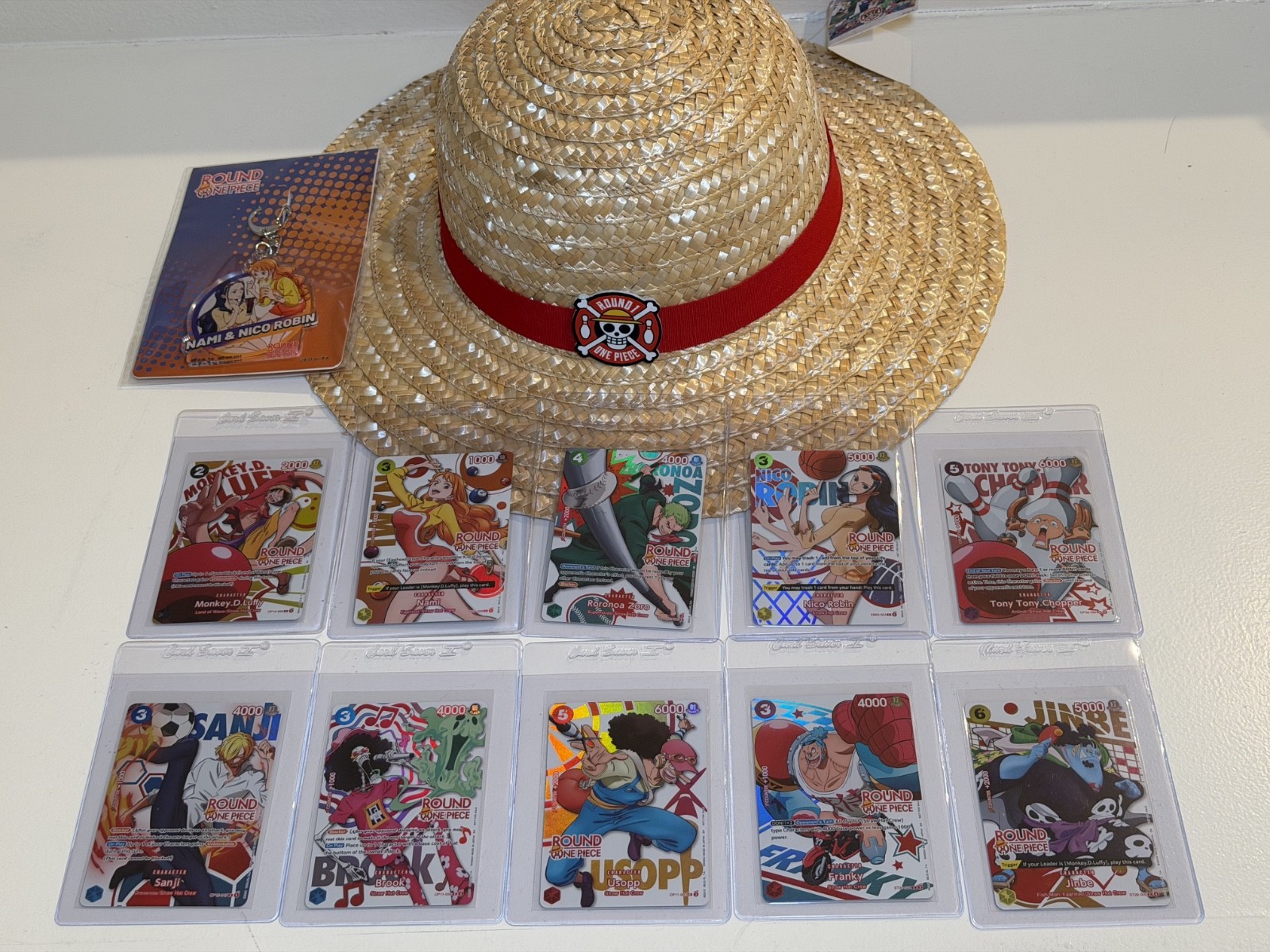 One Piece x Round1 English Promo 10 Cards Full Set w/ Hat and Nami Nico Keychain