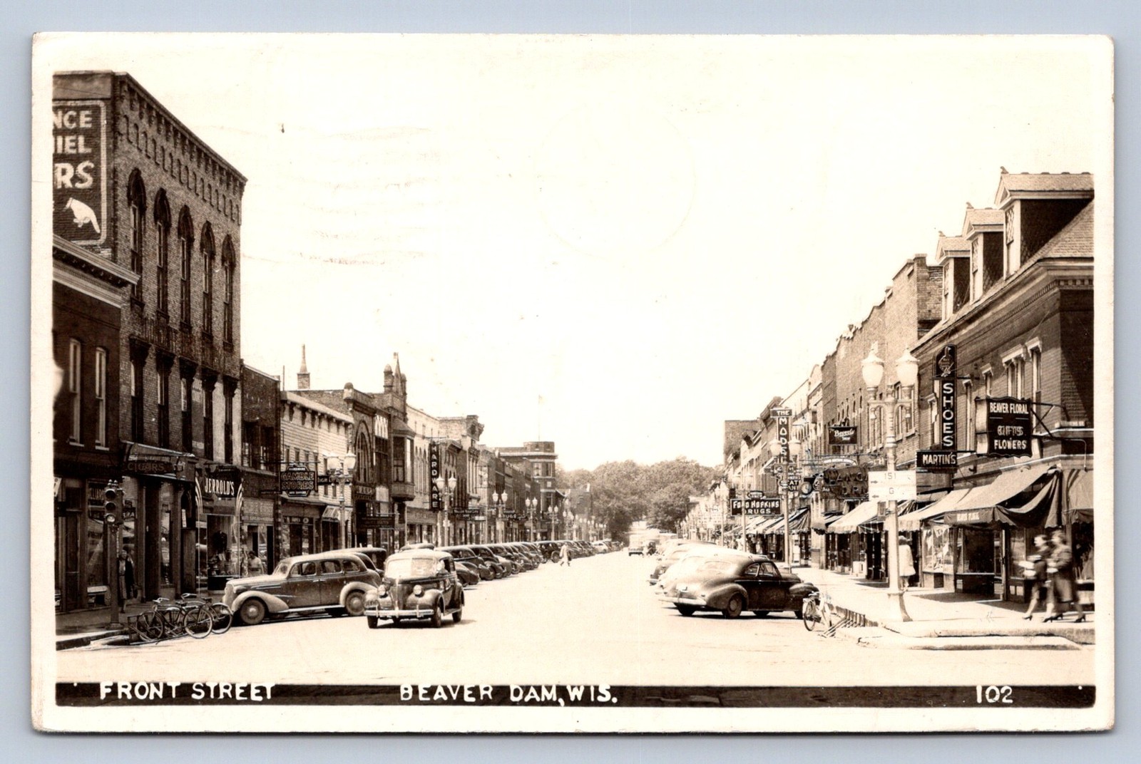 J90/ Beaver Dam Wisconsin RPPC Postcard c40-50s Front Street Stores 524