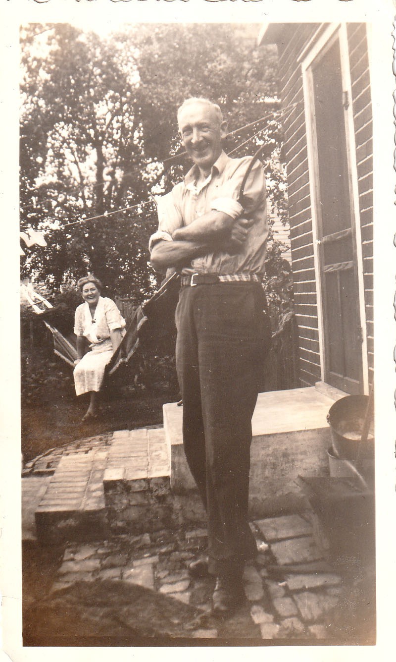 Vintage Photo Happy Man Woman Hamock Backyard America Brick Steps Arms Crossed