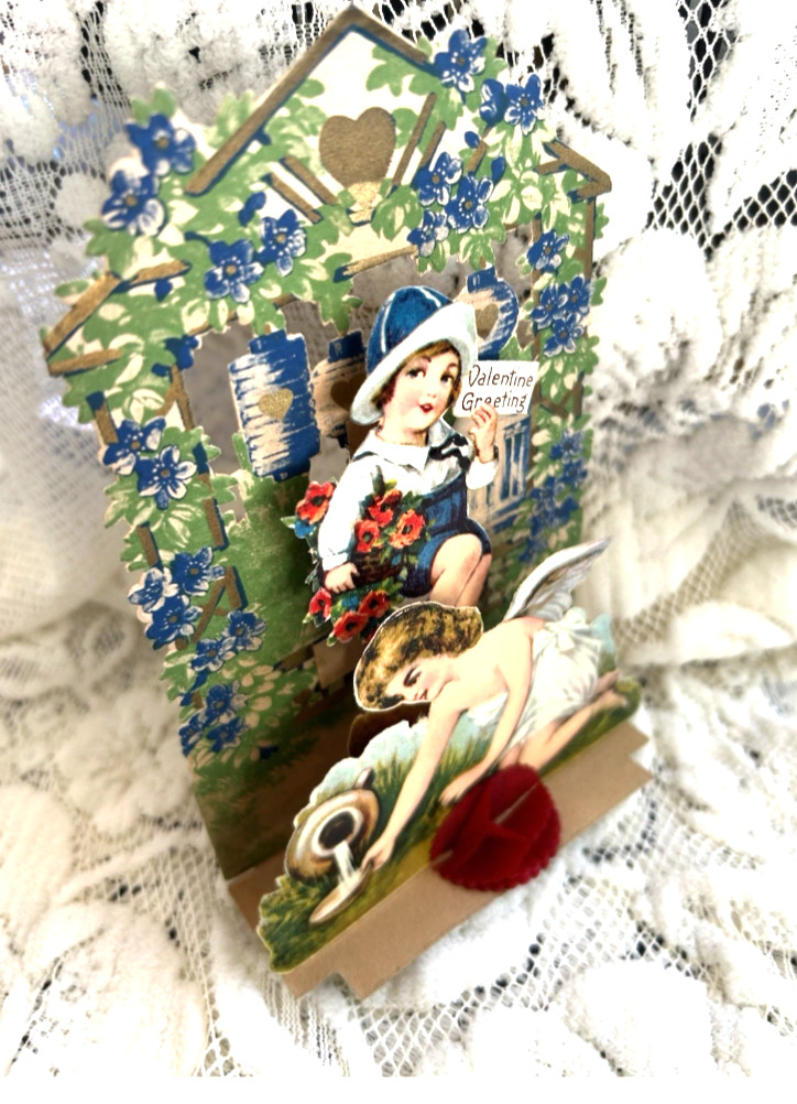 1900-s Antique Victorian Fold Pop Die Cut Card Valentine’s Cherub Watering Heart