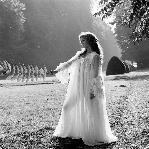 Doris Kunstmann in nightdress striking the pose in a garden 1970s Old Photo