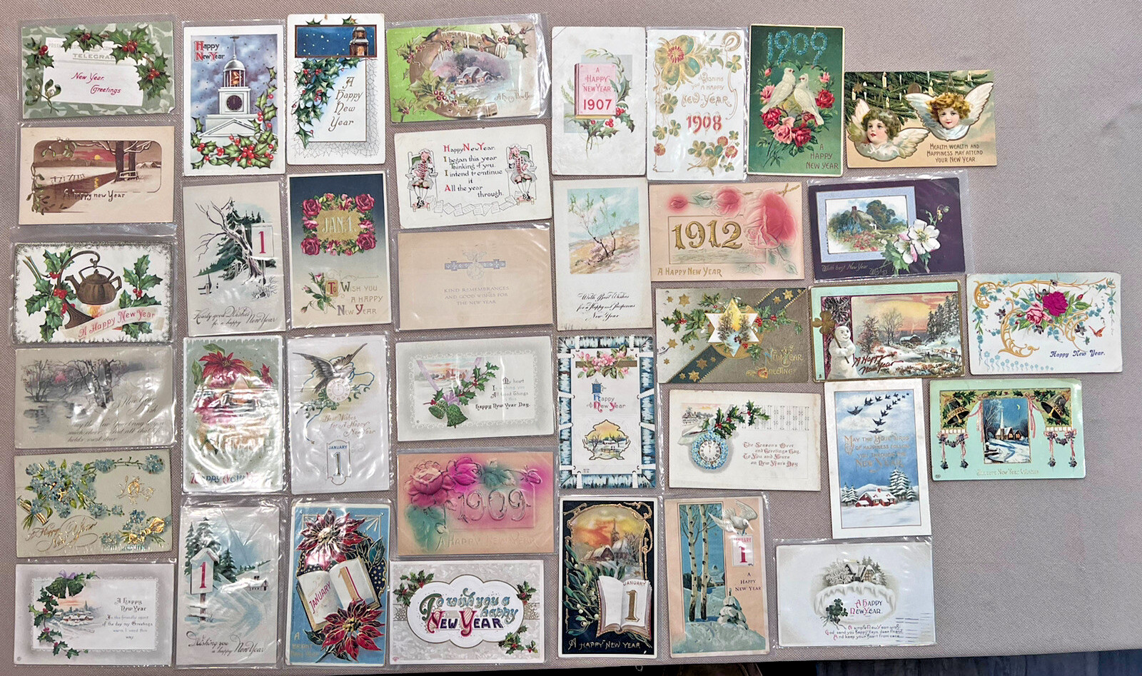 ANTIQUE LOT OF 37 NEW YEAR GREETINGS POSTCARDS FROM THE EARLY 1900\'S - A900