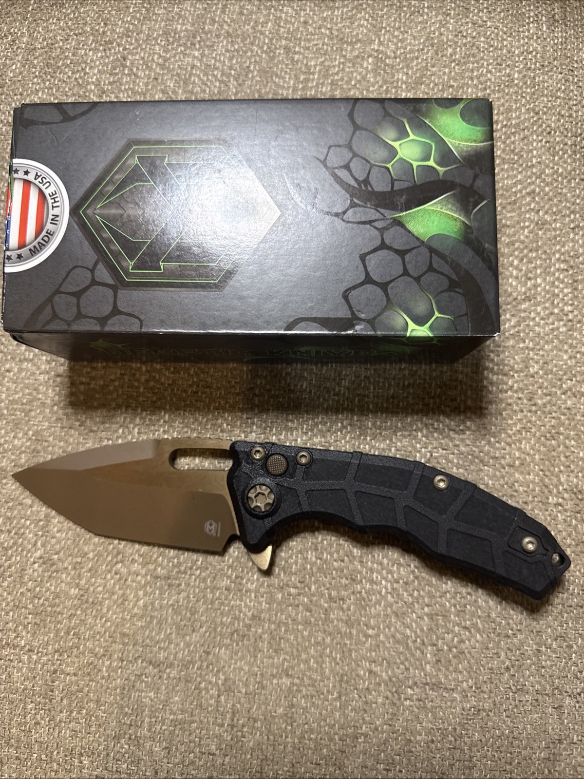 Heretic Knives Martyr Manual – Black Polymer Bronze MagnaCut Tanto H057-7A