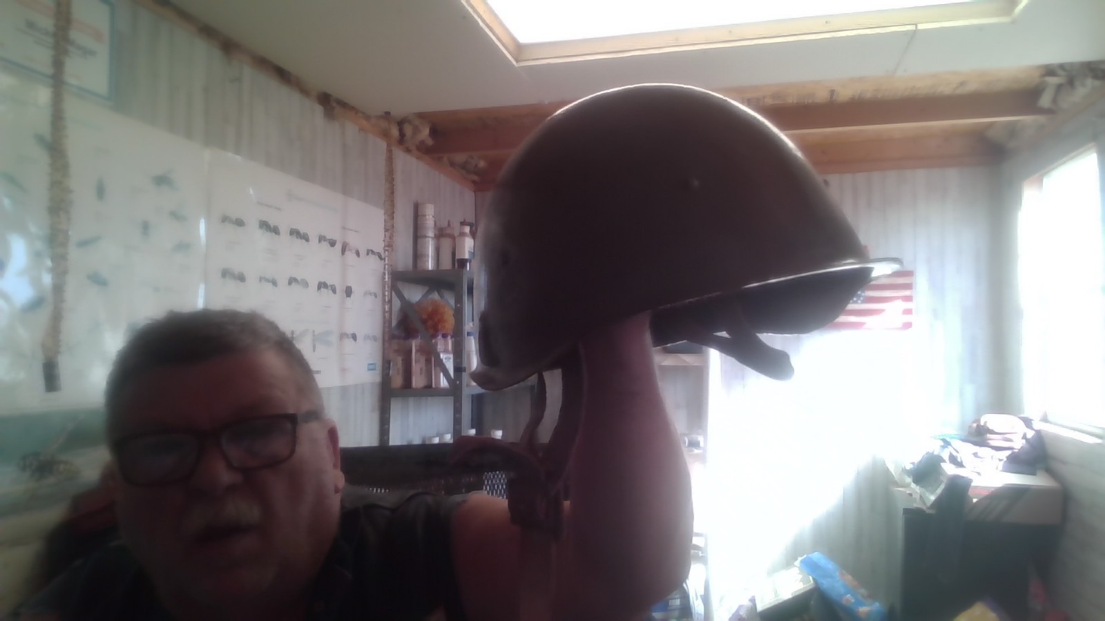 two military helmets and one patriatic box