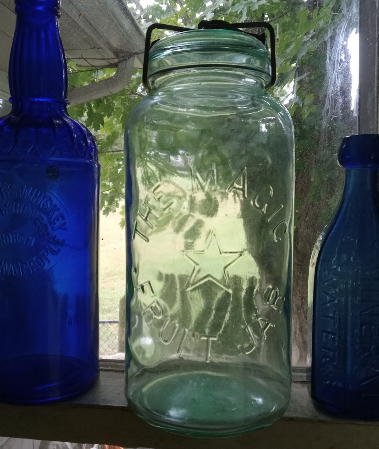 THE MAGIC STAR FRUIT JAR HALF GALLON WITH ORIGINAL 1886 GLASS LID & CLAMP NICE
