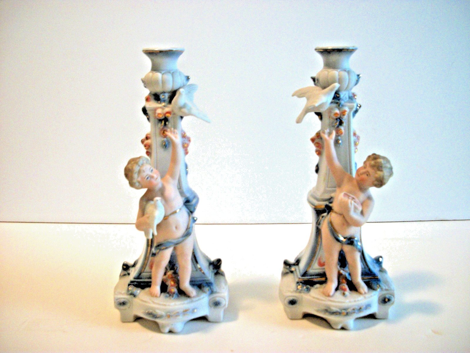 Pair White Porcelain Candle Holders Cherub Figures Blue Gold Trim