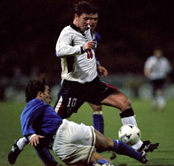 England\'s Matt Le Tissier leaps over the Italian defence during to- Old Photo