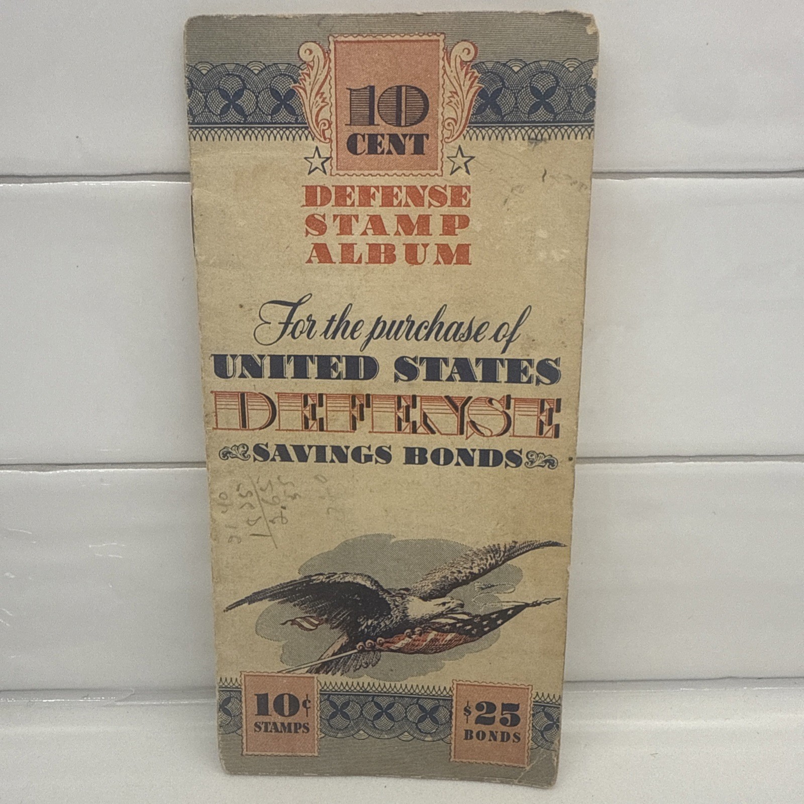 1942 U.S. Defense Savings Bond 10¢ Stamp Album Partially Filled WWII Era Vintage