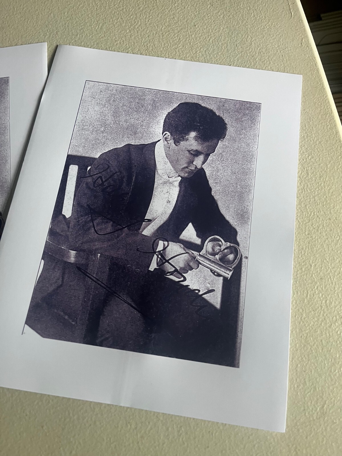 Harry Houdini, Reprint image of HH examining the Mirror Cuff,  almost beat him