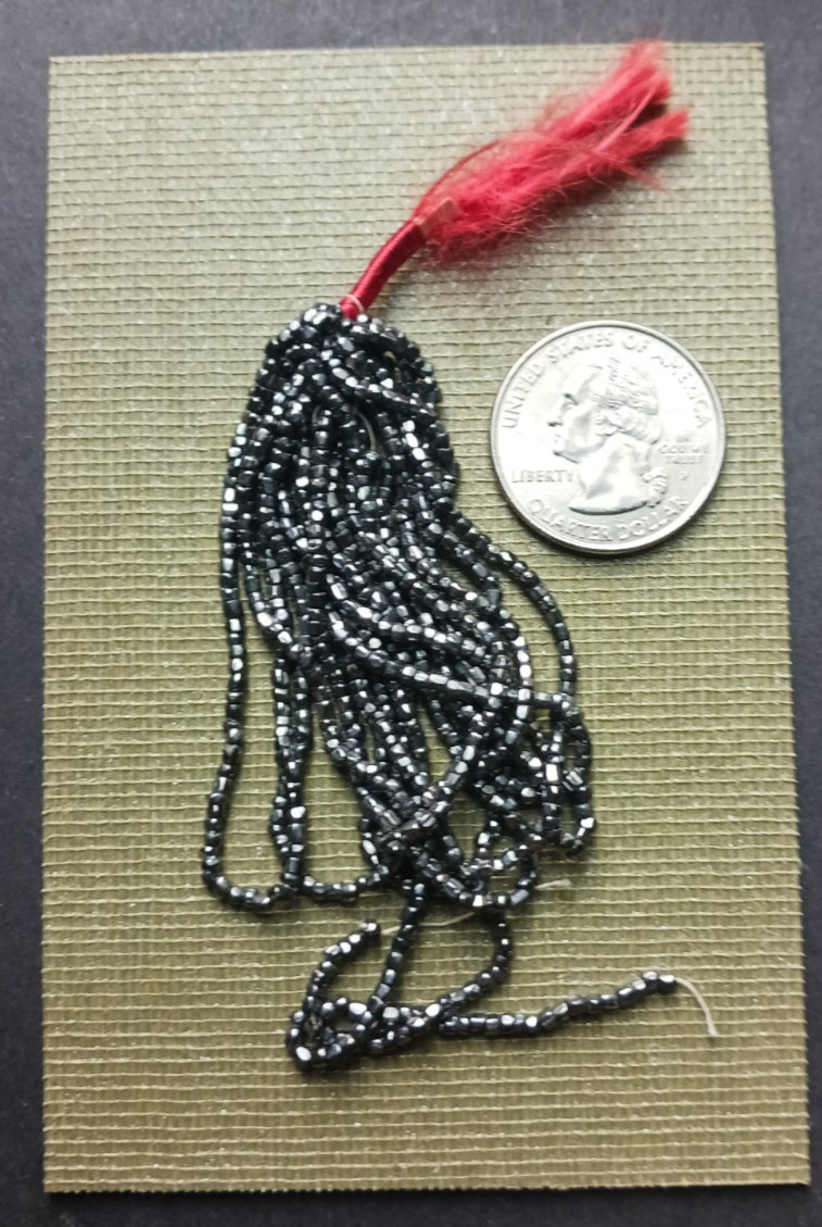 ANTIQUE STEEL CUT BEADS SILVER BLACK HANK AS SHOWN.