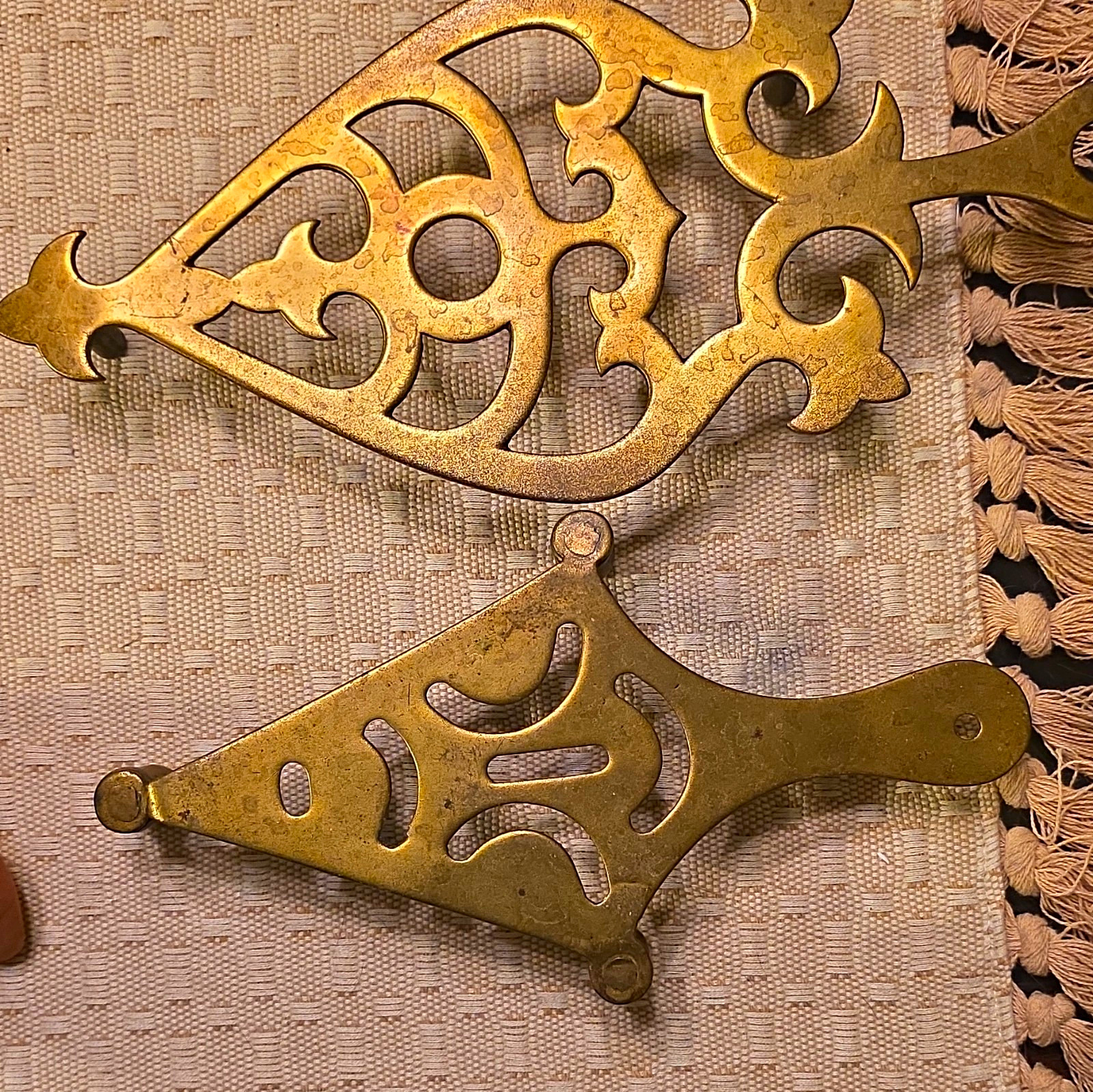 14 Antique Brass Trivets.