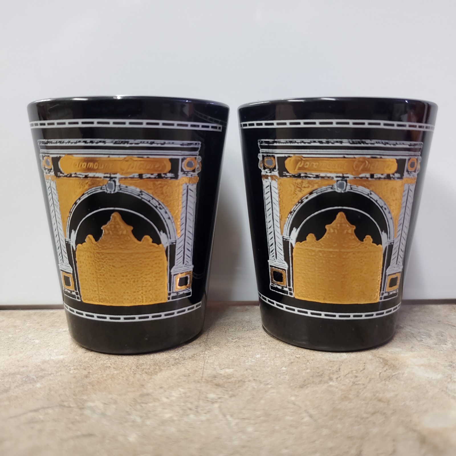 Paramount Pictures Gate Logo Shot Glasses. (2-PACK) 1995. Black and Gold. Rare