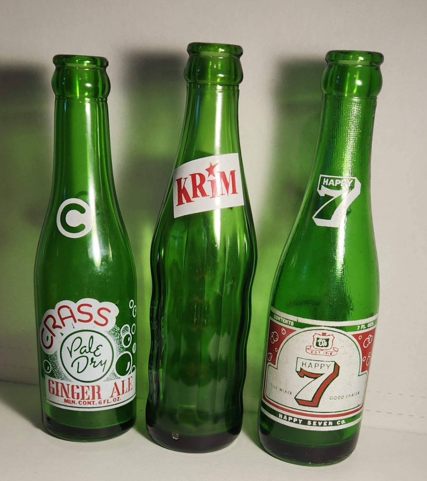 Lot Of 3 Vintage Soda Bottles 6oz Crass Ginger Ale And 7oz Krim And Happy 7
