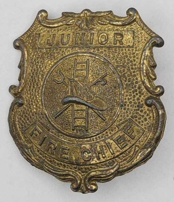 Vintage Tootsietoy Junior Fire Chief Cast Metal Pinback Badge Excellent Patina
