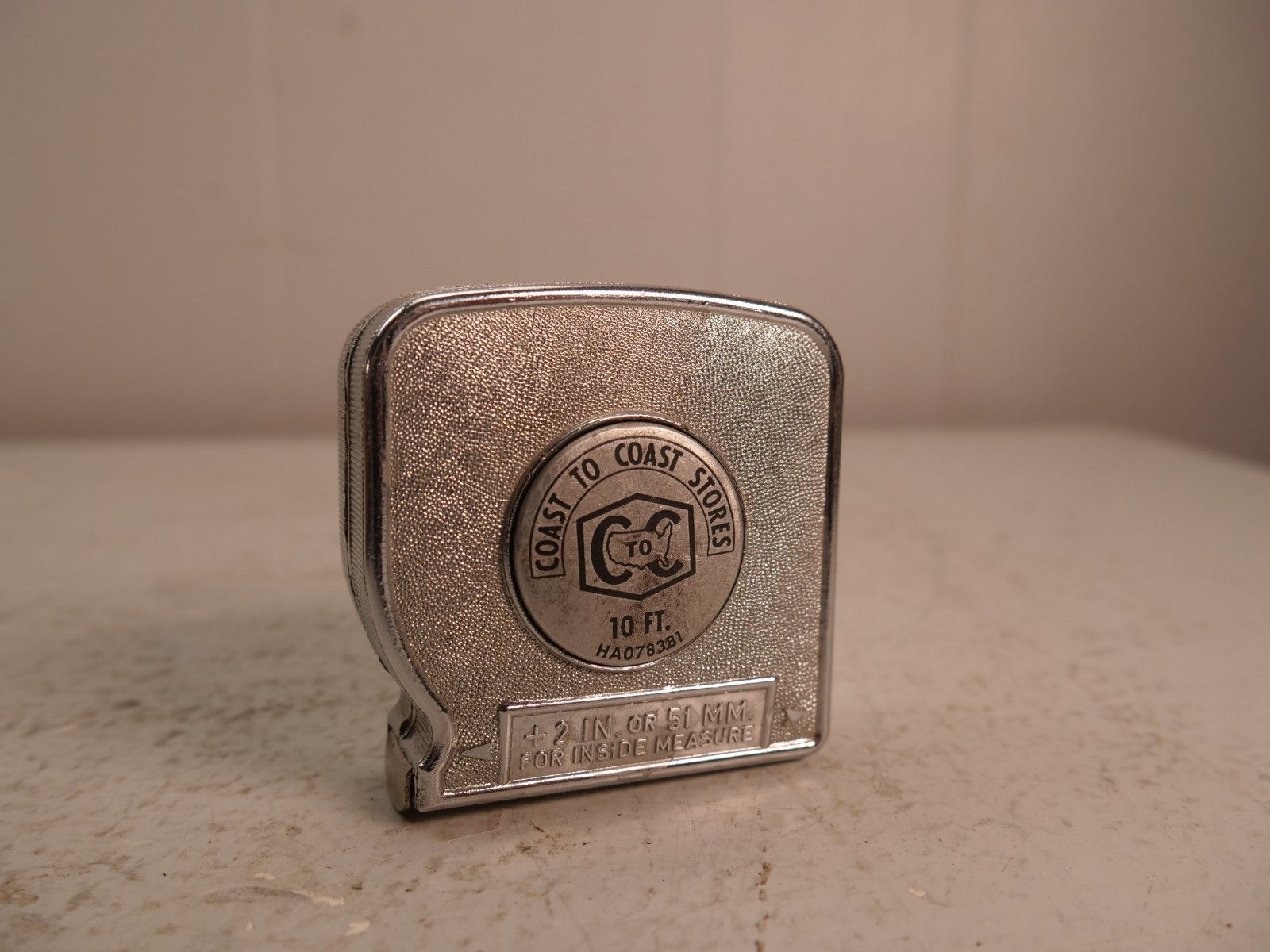 VINTAGE COAST TO COAST STORES PUSH BUTTON ROLL UP TAPE MEASURE