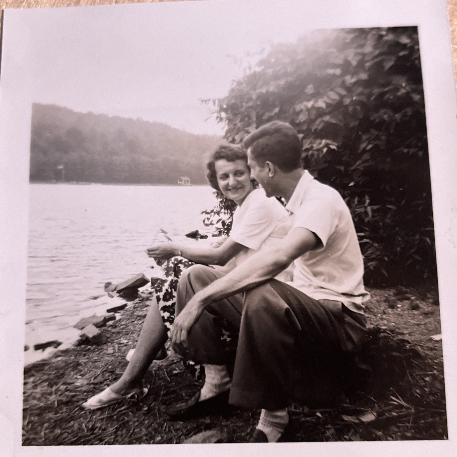 Vintage Snapshot Happy Affectionate Couple Sitting on Side of Lake --- U3