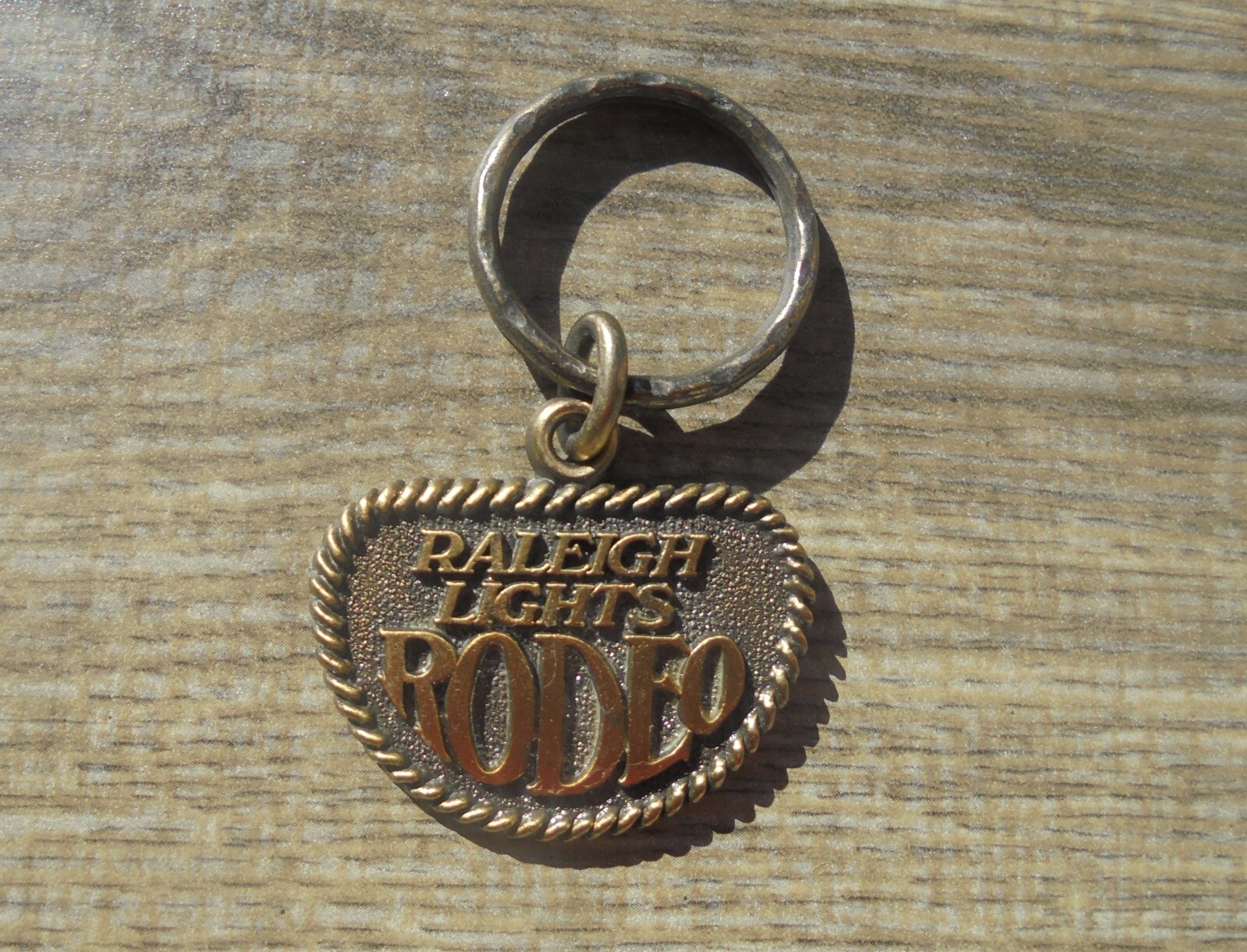 VINTAGE RALEIGH LIGHTS RODEO KEYCHAIN -NEW