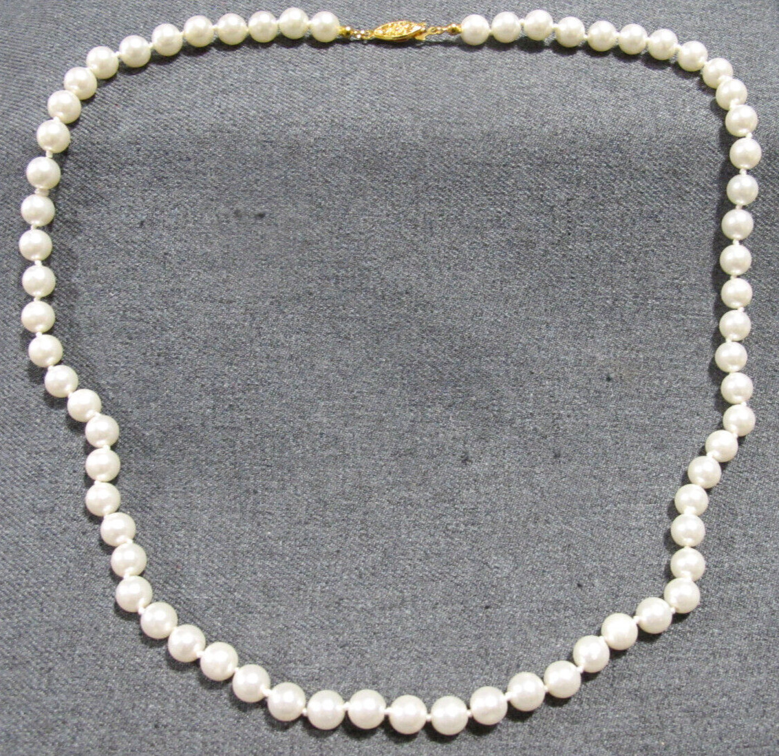 Vintage flower goldtone metal clasp hand knotted in between faux pearls necklace