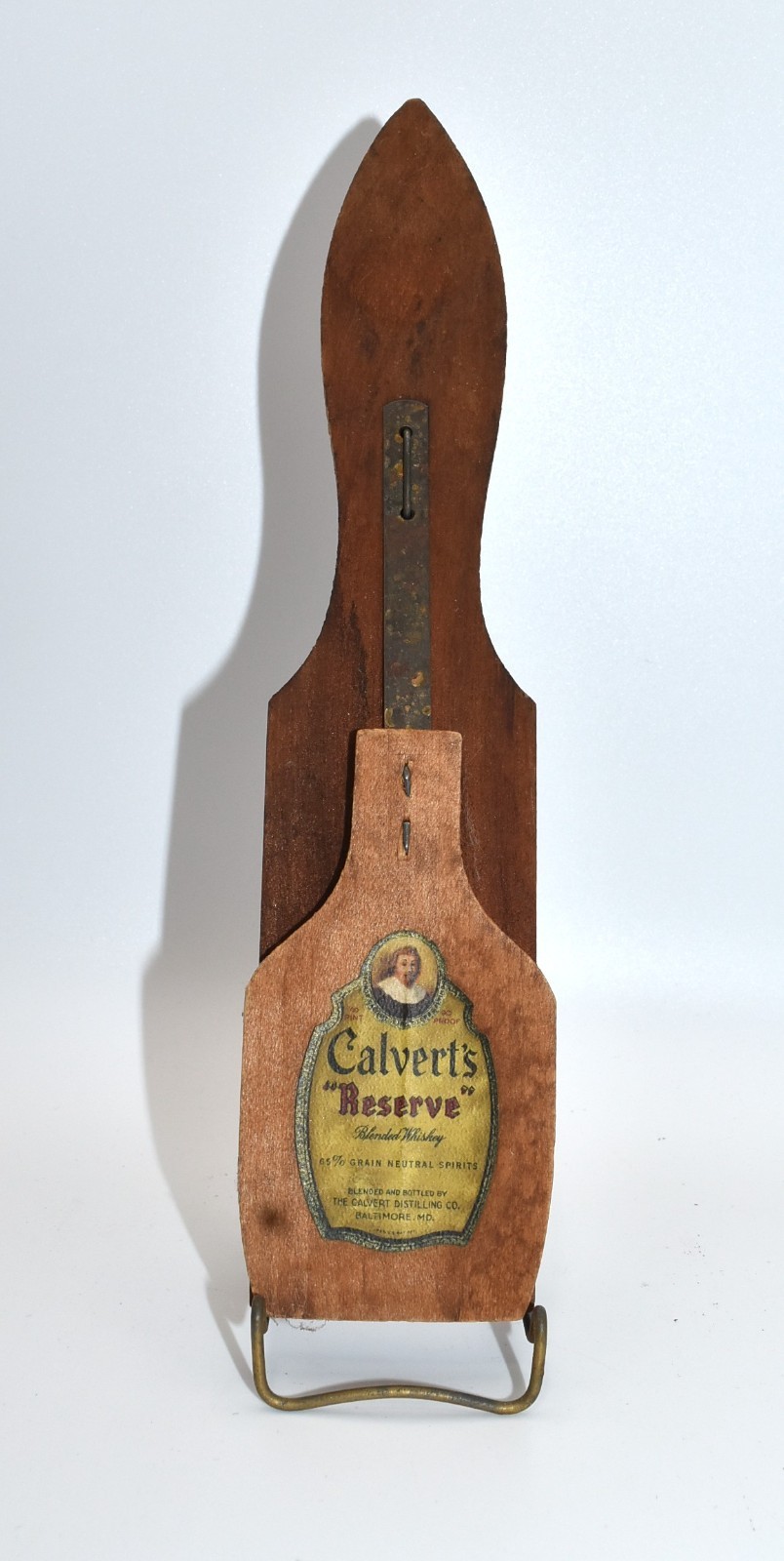 Vintage wooden Calvert\'s Whiskey advertising 2-sided noisemaker clapper
