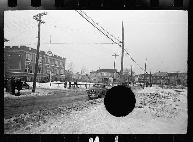 Photo:Snowy Street Scene 1935 Automobiles Buildings Crowds Winter Road