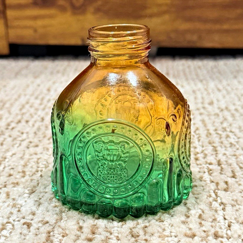 Green & Amber Glass Mini Bottle, Embossed Front Seal Design, Approx. 4 in Tall