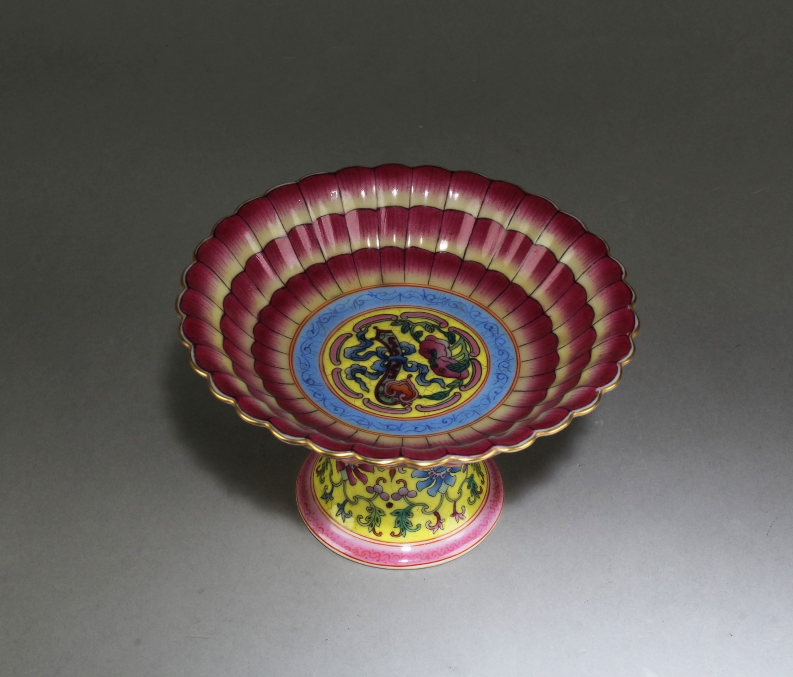 A Porcelain Stem Plate with fluted sides A Porcelain Stem Plate with fluted sides