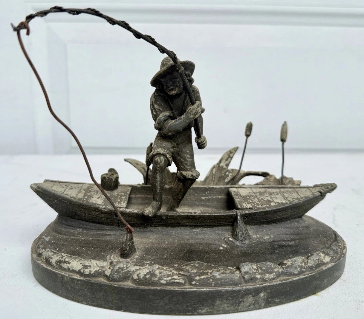 RARE Vintage Metal Fisherman in Boat Figurine on Oval Base Angling Nautical 