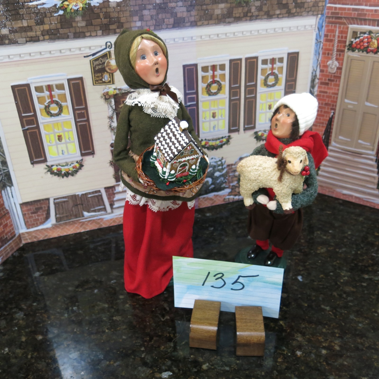 2 Byers Choice Young  Lady with House and Boy  $66 (Lot 135)  from 1999 & 2014