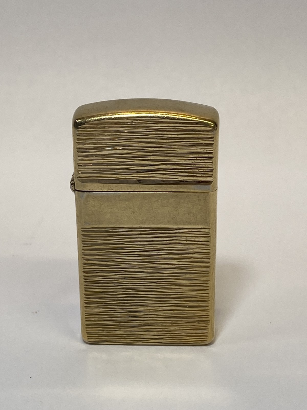 Vintage 1976 Zippo Gold Tone Bark Texture Panel Pocket Lighter USA