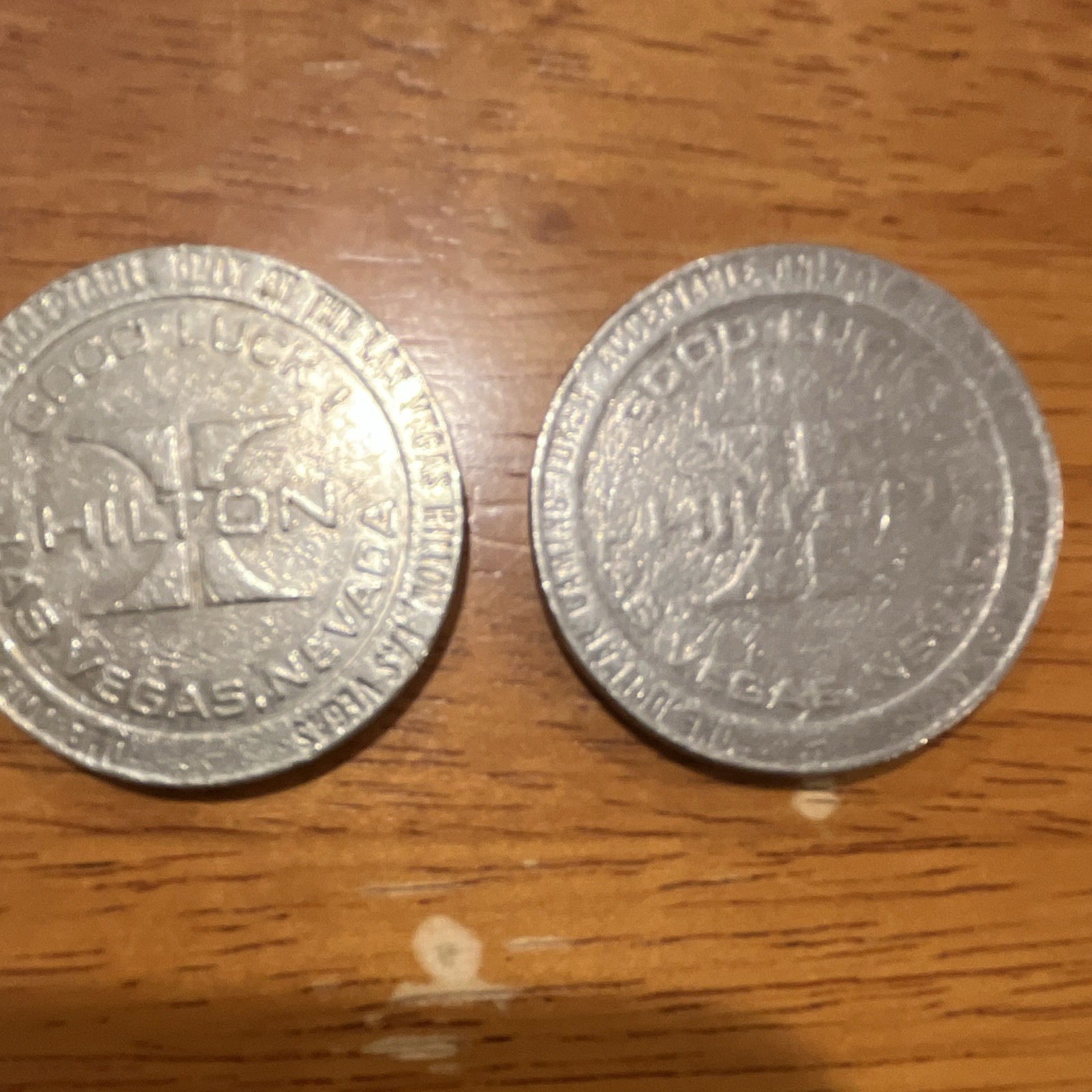 Vintage 1979 & 1985 Hilton Las Vegas NV Casino Tokens Lot of 2 SilverCollectible