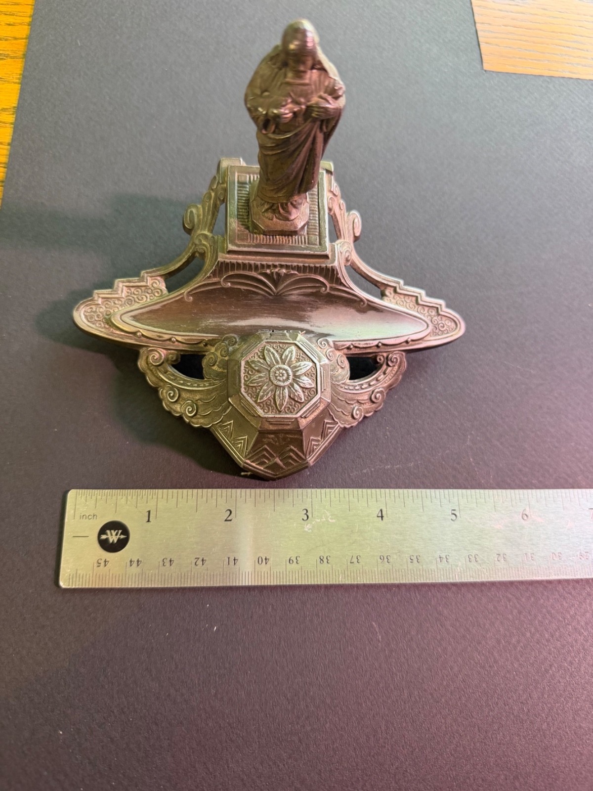 Antique ink well with religious figurine