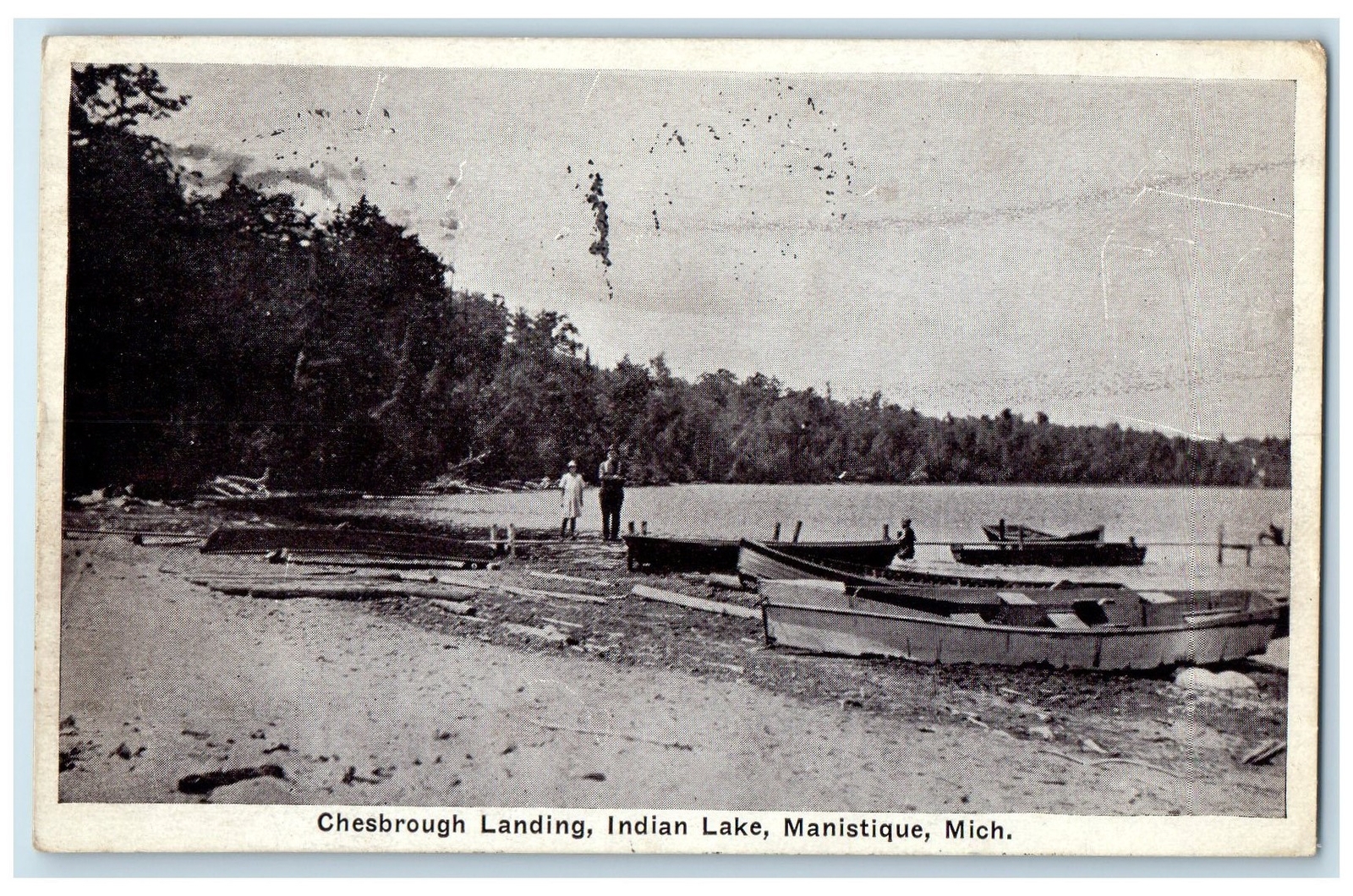 1926 Chesbrough Landing Indian Lake Boats On Shore Line Manistique MI Postcard