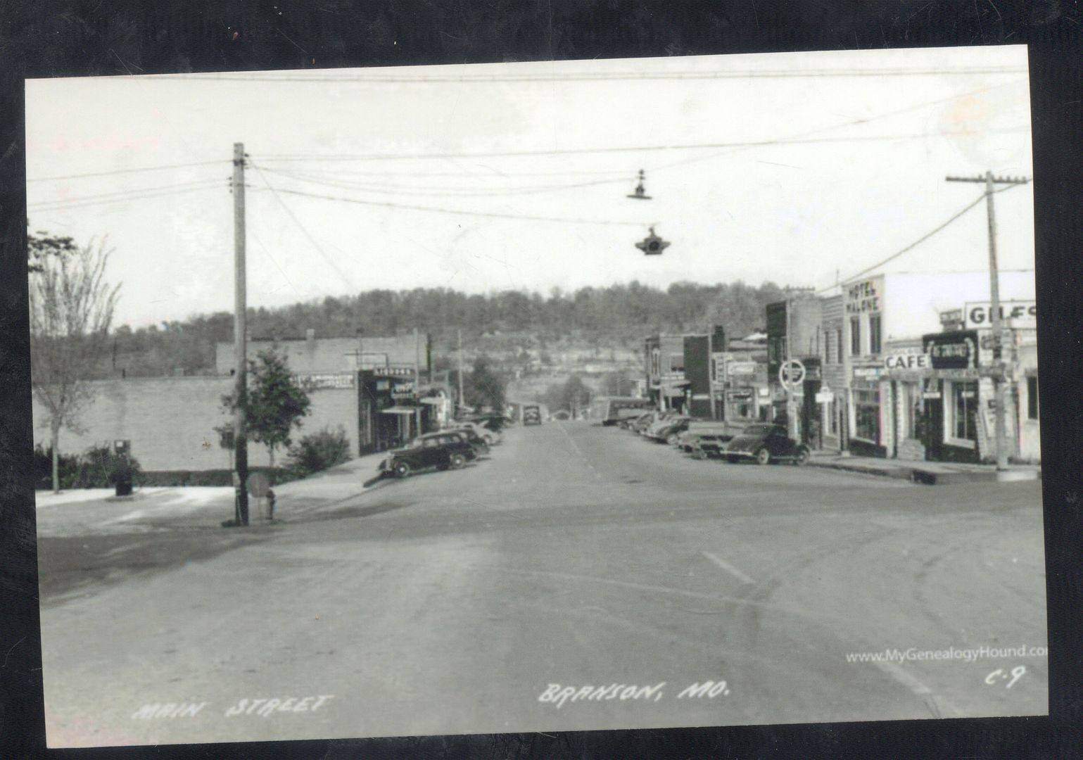 REAL PHOTO BRANSON MISSOURI MO. DOWNTOWN STREET SCENE OLD CARS POSTCARD COPY
