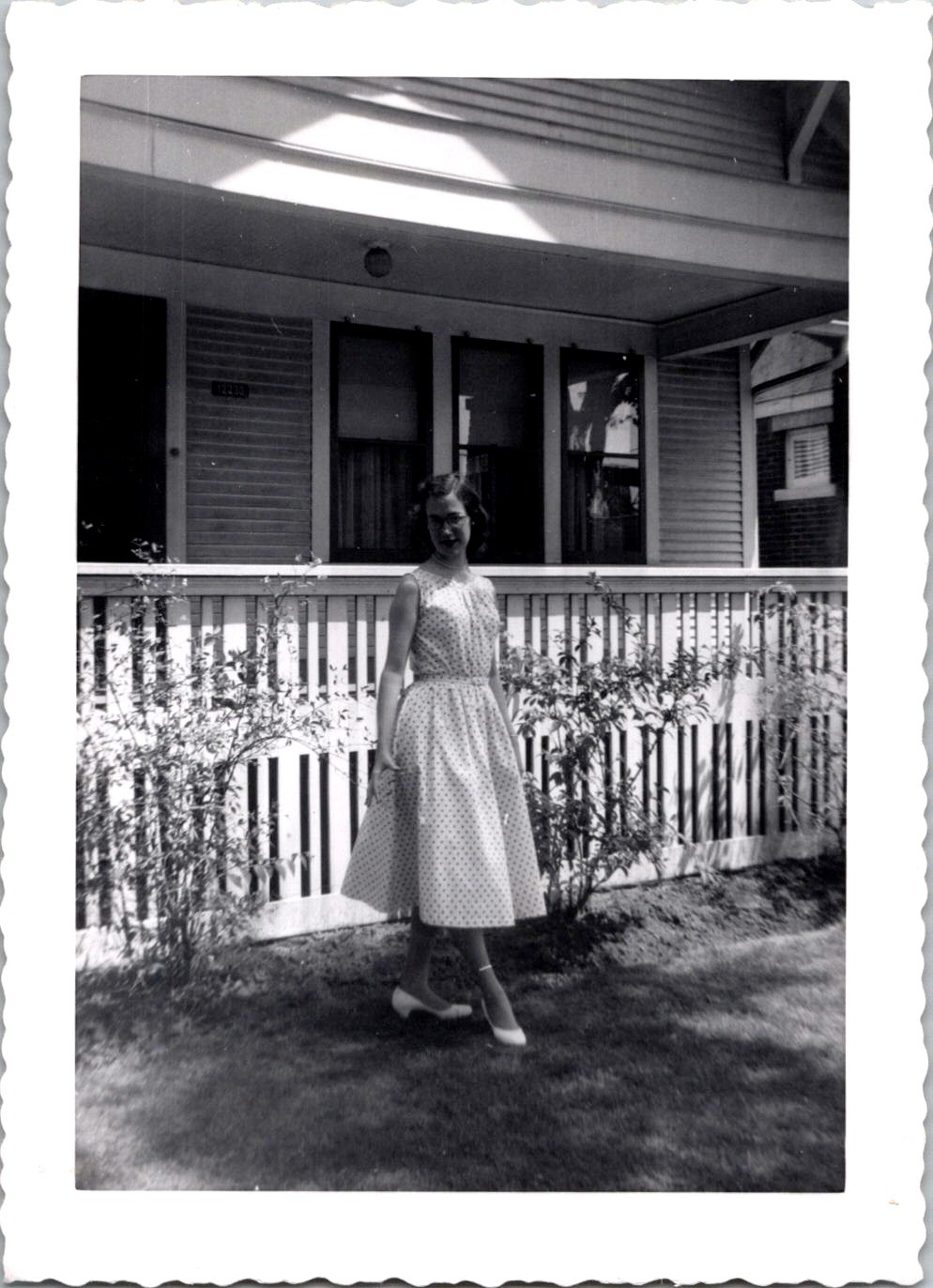 Young Woman in Polka Dot Dress, 1950s B&W Snapshot, USA Young Woman in Polka Dot Dress, 1950s B&W Snapshot, USA