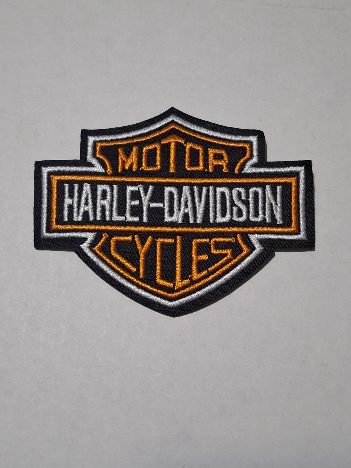 Embroidered Harley-Davidson Shield Iron On Patch White and Orange Embroidered Harley-Davidson Shield Iron On Patch White and Orange