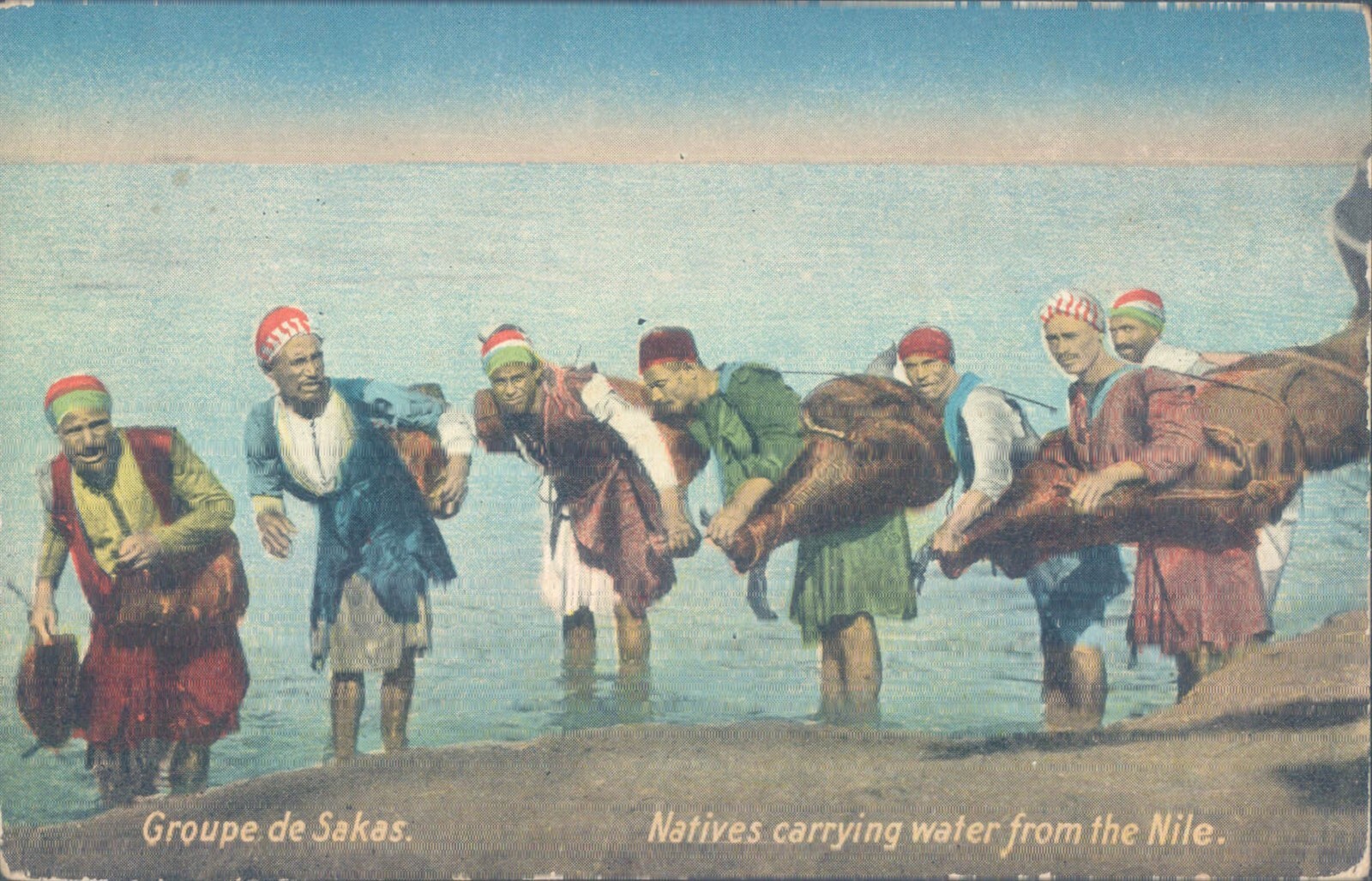 EGYPT natives carrying water from the nile 1910s PC