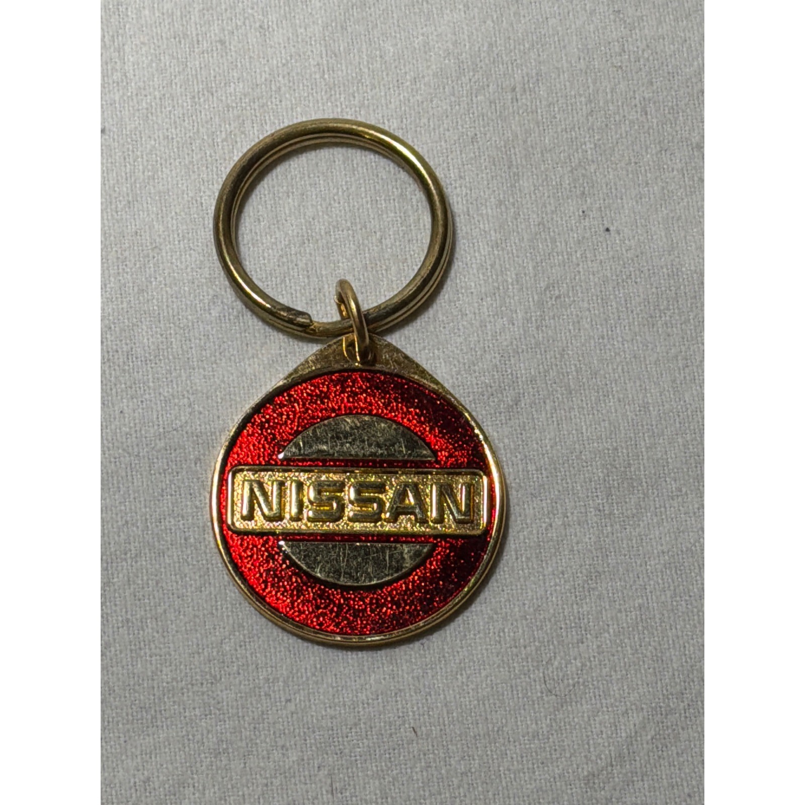 Vintage Nissan Gold Tone Red Glitter Enamel Round Keychain Car Enthusiast JDM