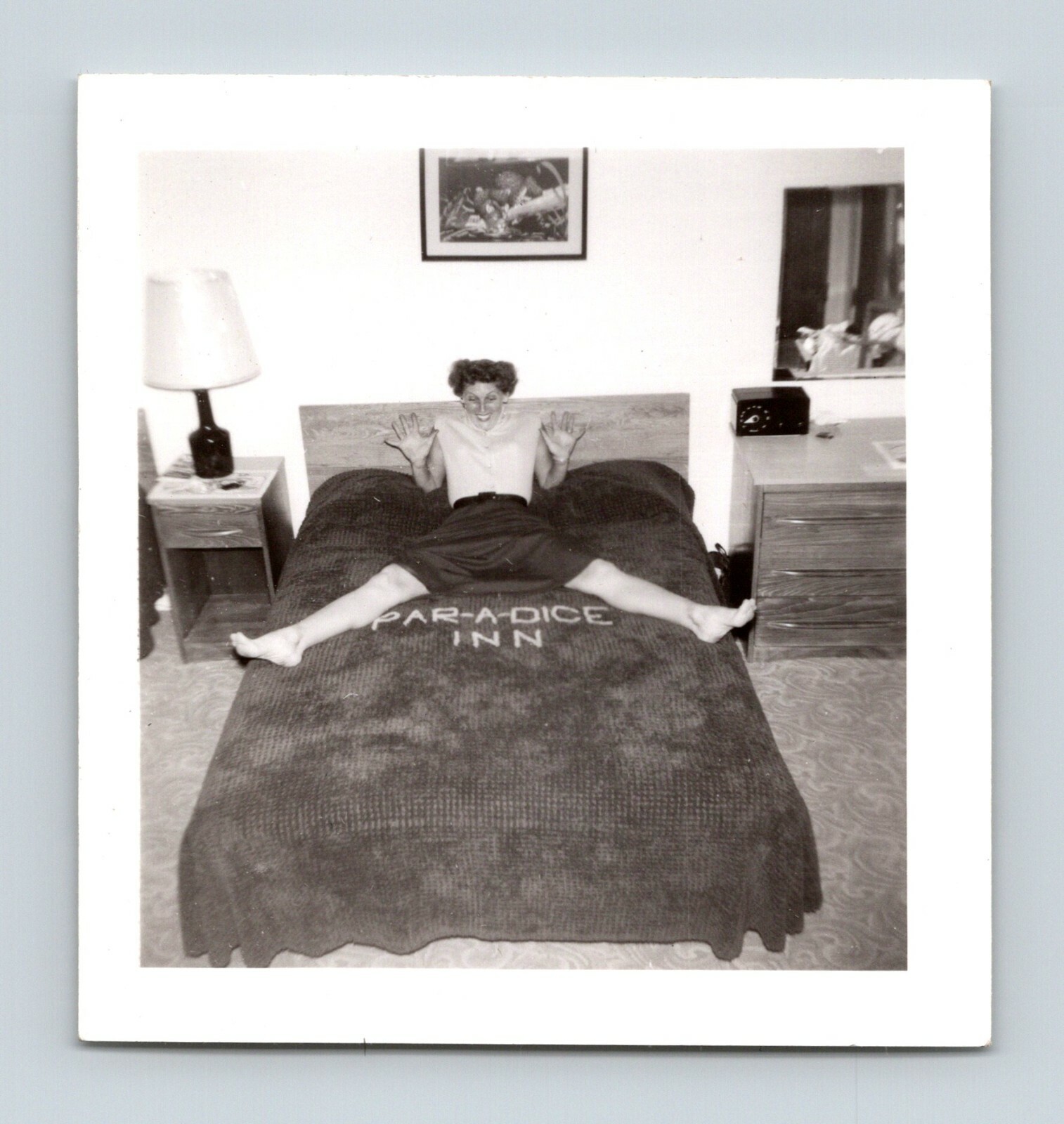 Par-A-Dice Inn Motel Interior View Woman Staddling Logo on Beadspread Cora Lue
