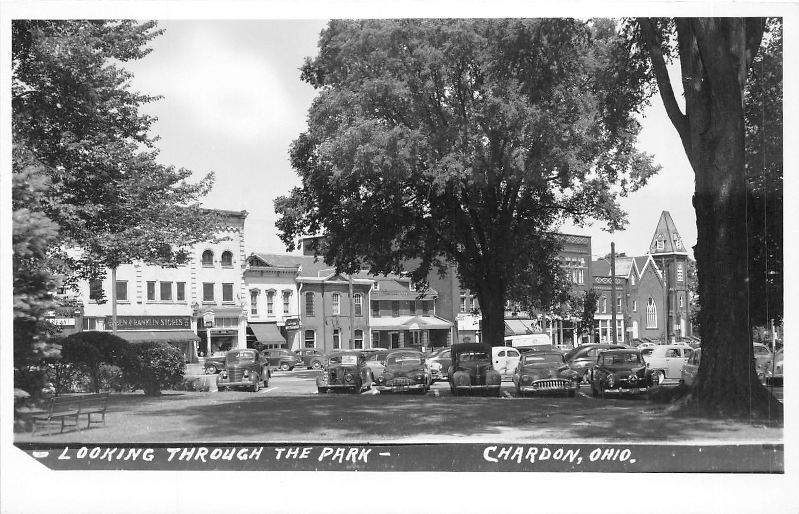 J70/ Chardon Ohio RPPC Postcard c1950s Looking Through Park Stores  331
