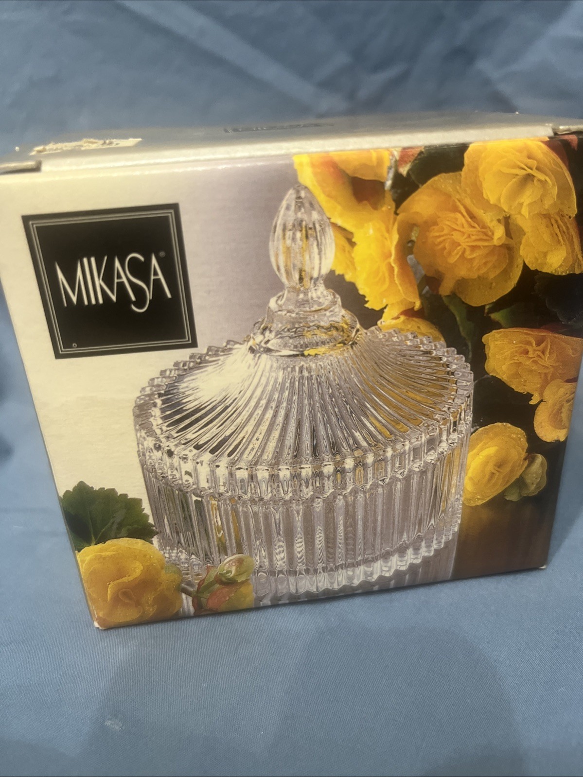 Elegant Mikasa crystal covered candy dish featuring a ribbed cut glass design.