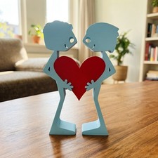 3D printed sculpture of two men united by heart symbolic love art picture