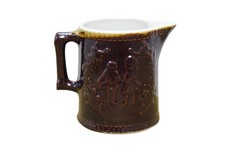 Antique Brown Glazed Stoneware Creamer Pitcher Jug w Silhouette Figures 7.5